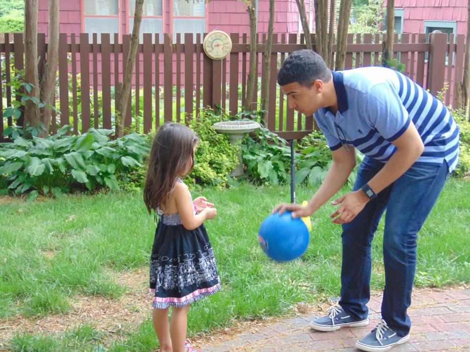 Roger Figueroa playing with his daughter
